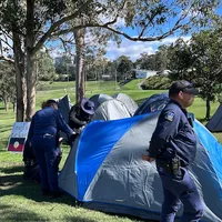 Two detained as police enter protest camp at Olympic stadium site